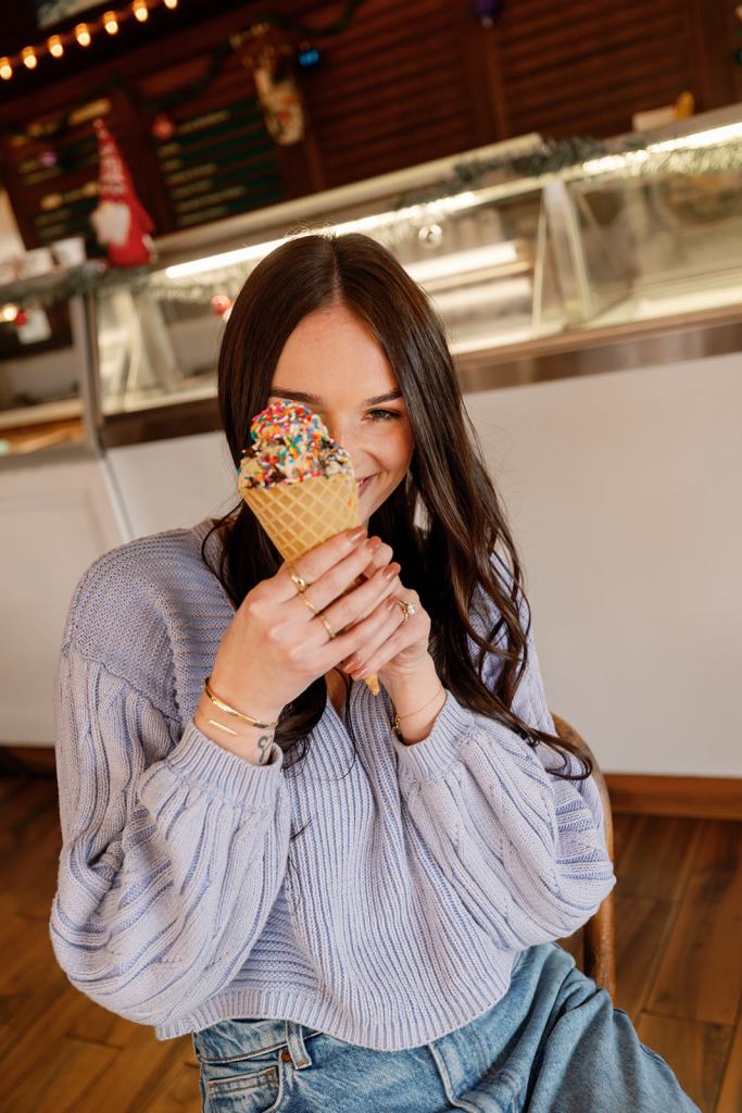 Maddie Weerts holding an ice cream cone and smiling